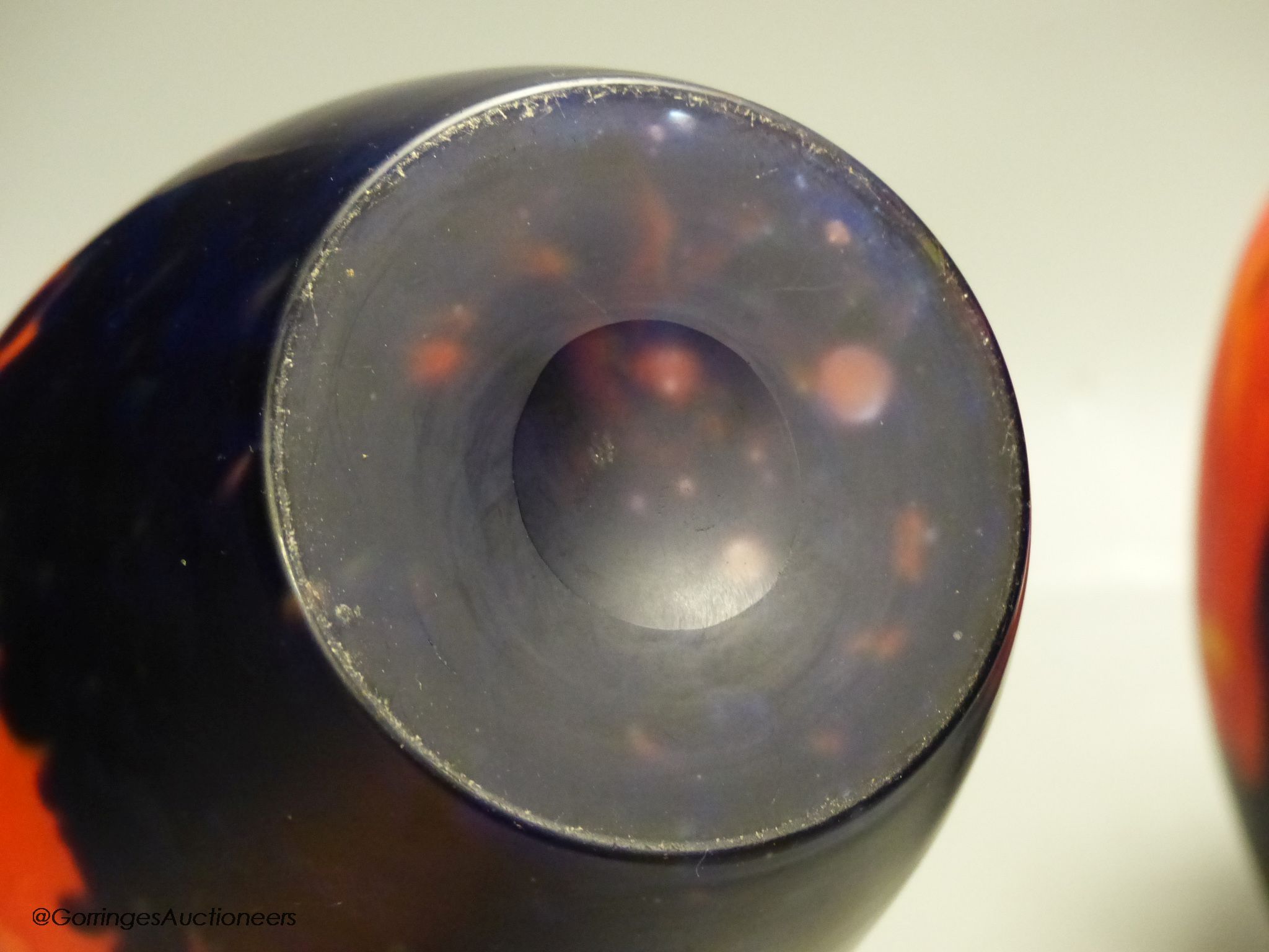 A pair of modern red and black art glass vases, height 23cm
